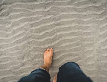 Person walking in the sand