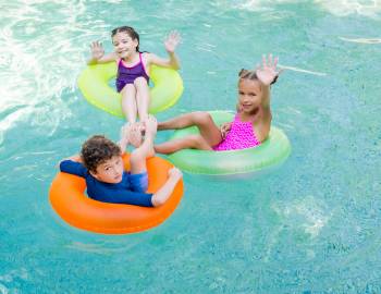 Children swim in a pool