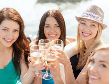 A group of friends cheers a round of drinks