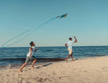 A couple flies a kite on the South Carolina Coast