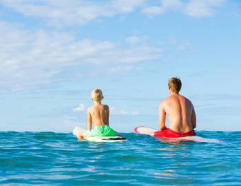 2 surfers in water