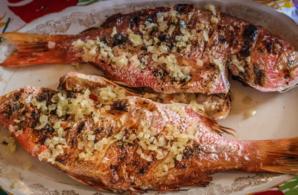 Guests enjoying the Feast of the Seven Fishes multi-course dinner at Tomasso at Turtle Point, Kiawah Island, South Carolina.