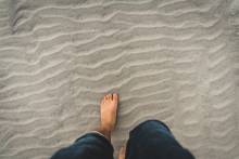 Person walking in the sand