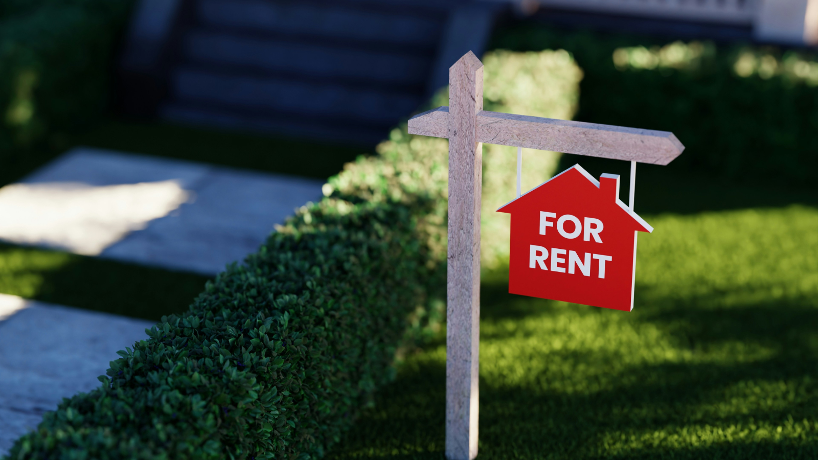 red for sale sign in a front yard