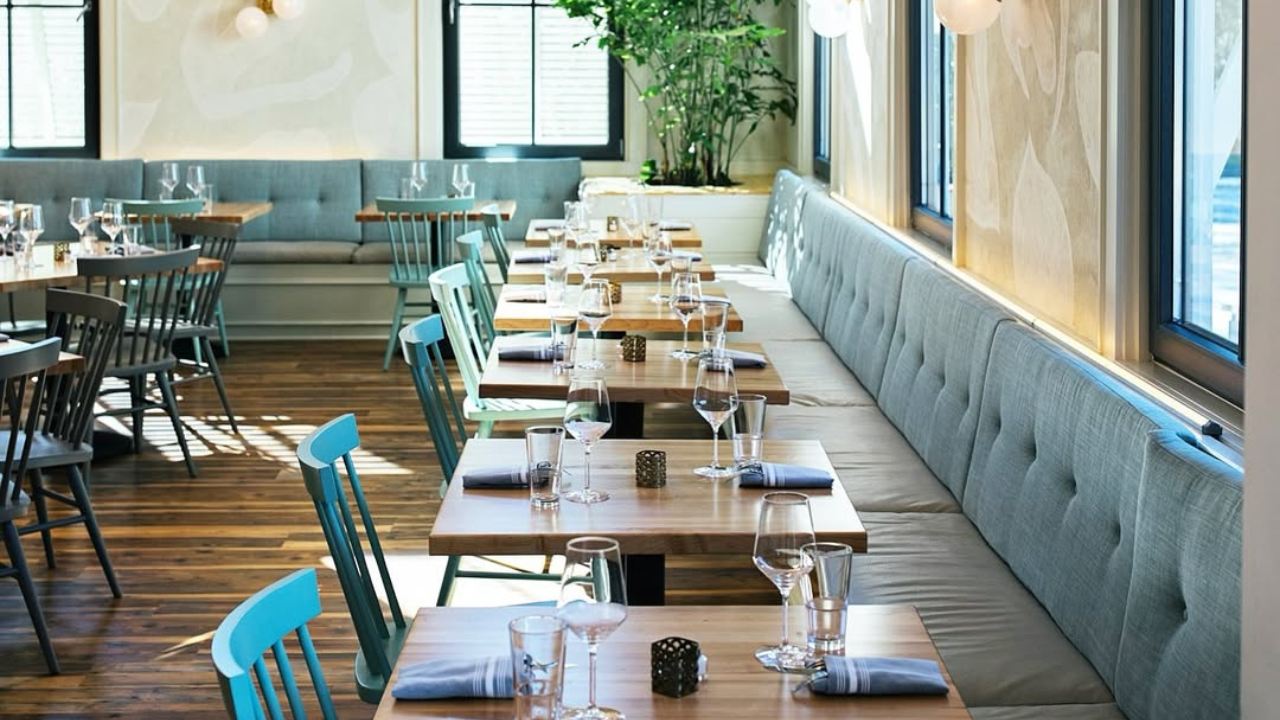 teal booths and tables in a restaurant