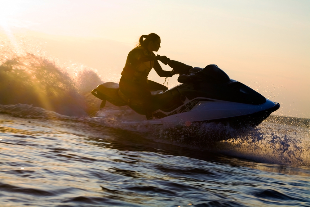 A person rides a jet ski